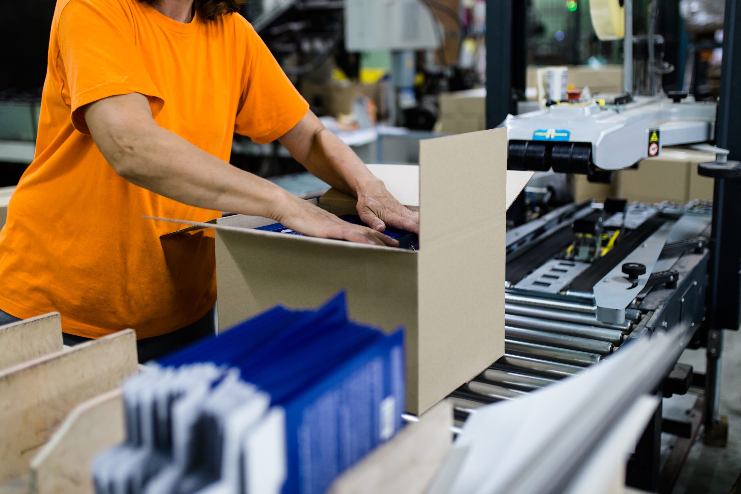 Worker Storing Package in the Box